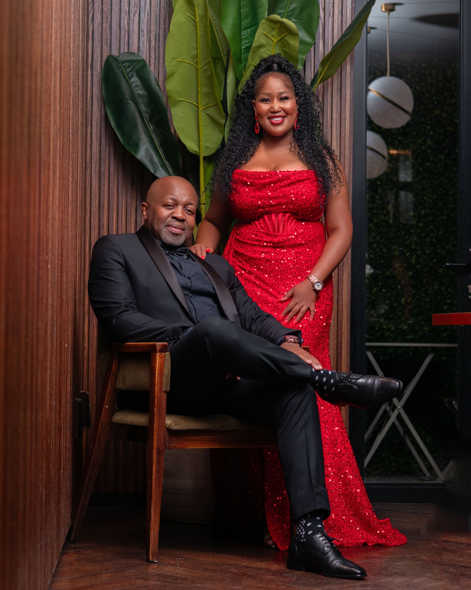 Couple in red gown and black tuxedo